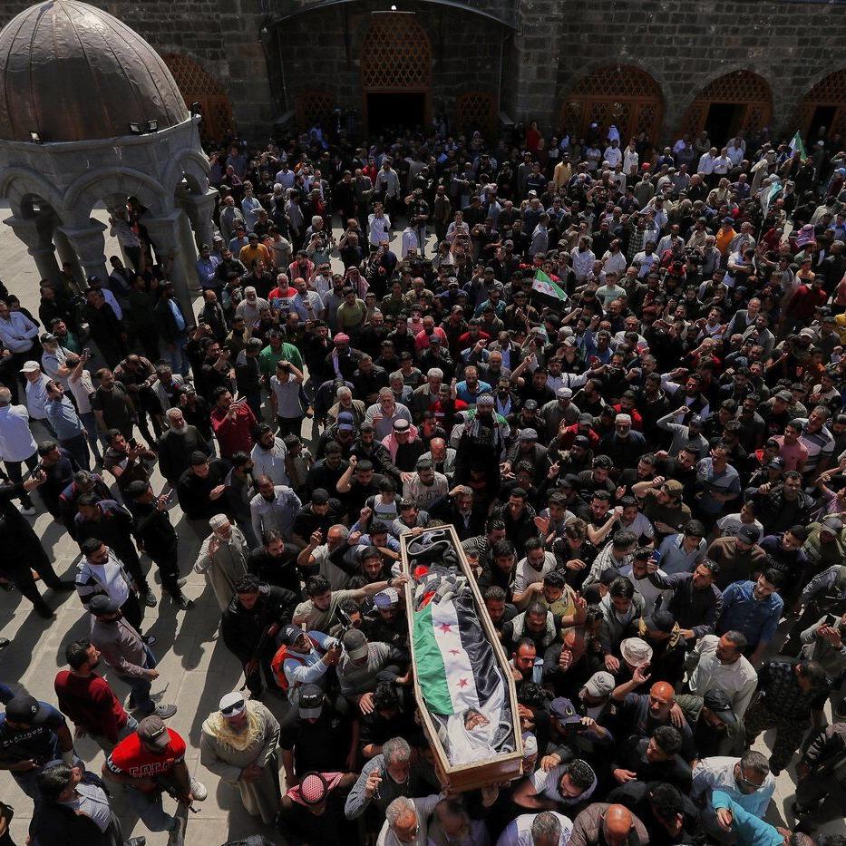 Mourners attend funeral of man killed in Israeli airstrikes on Syrian city of Daraa